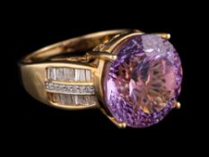A 9 carat gold amethyst and diamond ring:,