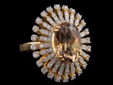 An 18 carat gold csarite and diamond ring:,
