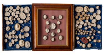 A group of Grand Tour plaster intaglios: contained in two book-shaped boxes (loose) and a framed