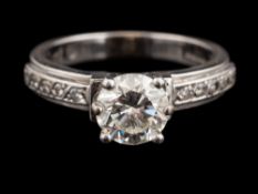 An 18 carat gold, platinum and diamond ring,: the central diamond estimated to weigh 1.