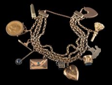 A gold coloured charm bracelet,: the four row bracelet suspending various charms,