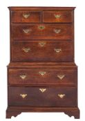 An 18th Century oak chest on chest:, the upper part with a moulded cornice,
