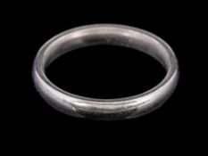 A platinum ring,: of plain polished form, stamped 950 with full London hallmarks, ring size J, 5.3g.