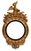 A Regency carved giltwood and gesso circular convex mirror:,