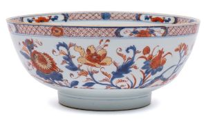 A Chinese Imari bowl: painted with pomegranate, peony,