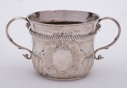 A Queen Anne Britannia silver porringer, maker Timothy Ley, London,