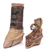 A Chinese bound foot mannequin: 17cm long, together with one silk shoe (2).