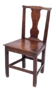 An 18th Century oak dining chair:, the back with shaped top rail and solid vase-shaped splat,