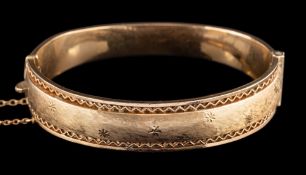 A 1960s 9 carat gold bangle,