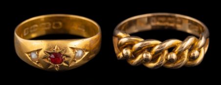 A late Victorian 18 carat gold ring,: the knotted panel with beaded detail,