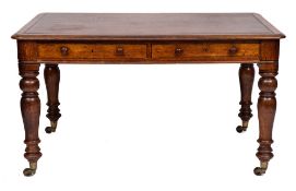 A Victorian oak library table:, the rectangular top with inset leather panel,