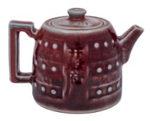 A Chinese copper red glazed teapot and cover: of circular squat form,