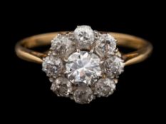 A diamond cluster ring,: the central old brilliant cut diamond, estimated to weigh 0.