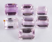 Seven unset kunzites,: the rectangular cut kunzites, approximately 133.00 carats total.