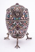 A late 20th century silver gilt and champlevé enamel Easter egg in the Imperial Russian style: