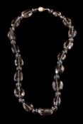 A smoky quartz necklace,: the faceted smoky quartz beads to a textured ball shaped clasp,