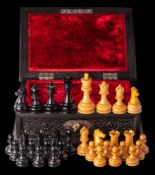 A boxwood and ebonised Staunton pattern competition size chess set: the king 9.