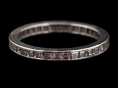 A diamond eternity ring,: set with square cut diamonds, ring size N.