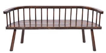 WITHDRAWN A 19th Century oak rustic seat:, the back with curved bar top rails,