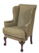 A carved mahogany wing frame armchair in the George II taste:,