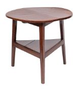 A 19th Century oak circular cricket table:, on triangular section splayed legs,