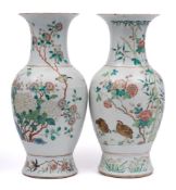 A pair of Chinese famille rose baluster vases: each painted with quail and other birds amongst
