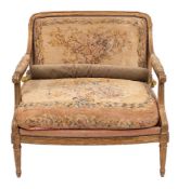 A French carved giltwood and petit point embroidered canapé in Louis XVI style, by Maison Jansen,