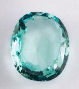 An unset aquamarine,: the oval cut aquamarine, weighing approximately 31.00 carats, 25mm x 21mm x 9.