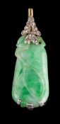 A 1920s jadeite and diamond panel,: the carved jadeite with a rose cut diamond set surmount,
