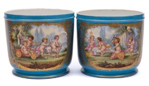 A pair of Sevres-style cachepots: each decorated in the manner of Watteau with cherubs in a