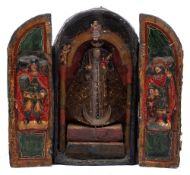 A papier mâché and polychrome decorated triptych: possibly South American, of arched outline,