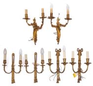 Three pairs of gilt metal twin-light wall appliques,