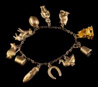 A charm bracelet,: with various charms, including a cat, a duck, a donkey, a shoe, and others,