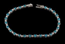 A diamond and treated blue diamond bracelet,