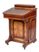 A Victorian walnut, amboyna, banded and inlaid Davenport:, bordered with boxwood and ebony lines,
