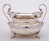 An Edward VII silver sugar basin, maker Walker & Hall, Sheffield, 1901: of barge-shaped outline,