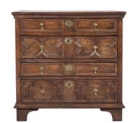 A 17th Century oak rectangular chest:, the top with a moulded edge,