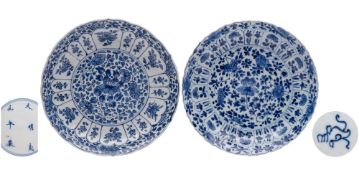 Two Chinese blue and white moulded dishes: each painted with lotus, other flowers and foliage,