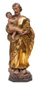 An Italian carved, painted and parcel giltwood group of Saint Joseph and the Infant Christ,