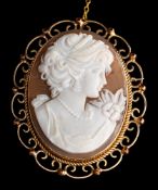 A 9 carat gold and shell cameo,: the oval shell cameo carved with a lady's profile,