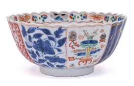 A Chinese verte-imari chrysanthemum moulded bowl: with lobed sides and scalloped rim,