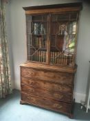A George III mahogany and inlaid secretaire bookcase:,