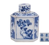 A Chinese blue and white lozenge section tea canister and cover: painted with bamboo and flowering