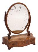 A George III mahogany and inlaid oval swing frame platform toilet mirror:, crossbanded in kingwood,