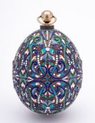A late 20th century silver gilt and champlevé enamel Easter egg in the Imperial Russian style: