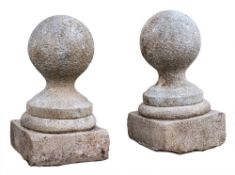 A pair of Dartmoor granite pier finials, 19th century,: modelled as spheres,