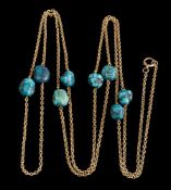 A late 19th/early 20th Century gold and turquoise matrix bead mounted guard chain,