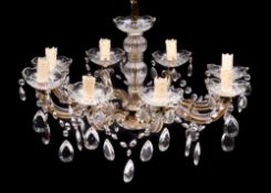 An eight-branch clear glass chandalier: with swept branches and circular drip trays linked by
