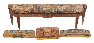 A Louis XVI carved oak and tapestry upholstered window seat, basically circa 1780,