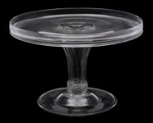 An 18th century glass circular tazza: with galleried top, on hollow pedestal stem and domed foot,